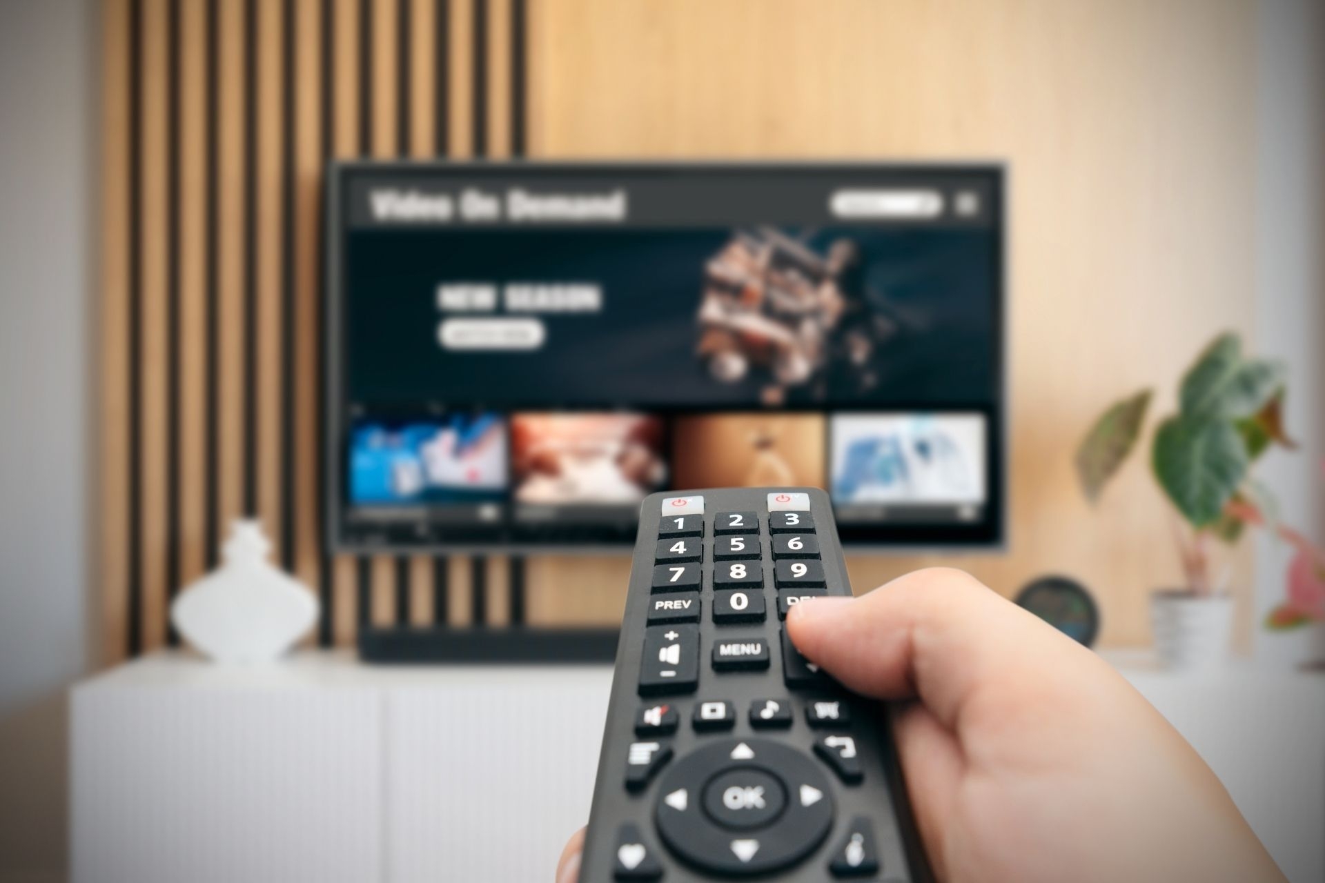 How does fiber optic TV technology enable interactive features such as on-demand programming and video calling?